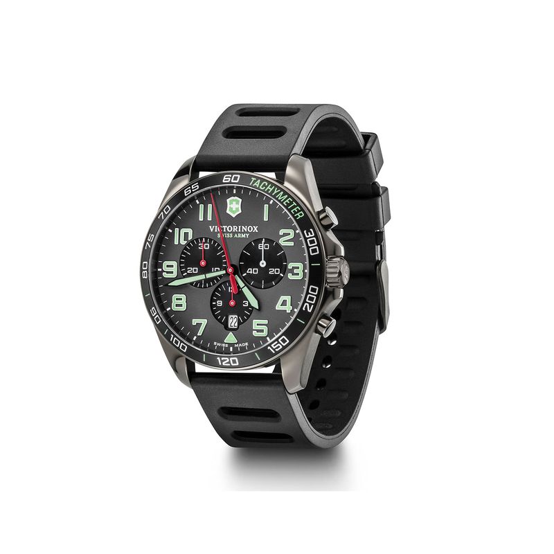Relógio de pulso com mostrador preto, detalhes em verde e vermelho, pulseira preta de silicone e função cronógrafo.