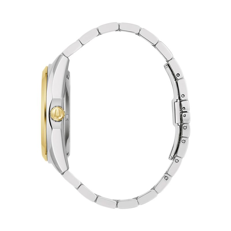 Relógio com pulseira de metal prateada, caixa em prata com detalhes dourados e uma coroa dourada.