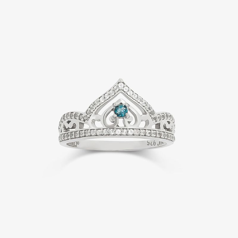 Anel de prata com design de tiara, detalhes em zircônia e uma pedra azul no centro.