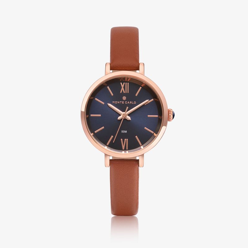 Relógio de pulseira marrom com mostrador azul escuro e detalhes em dourado rosé, exibindo a marca Monte Carlo.