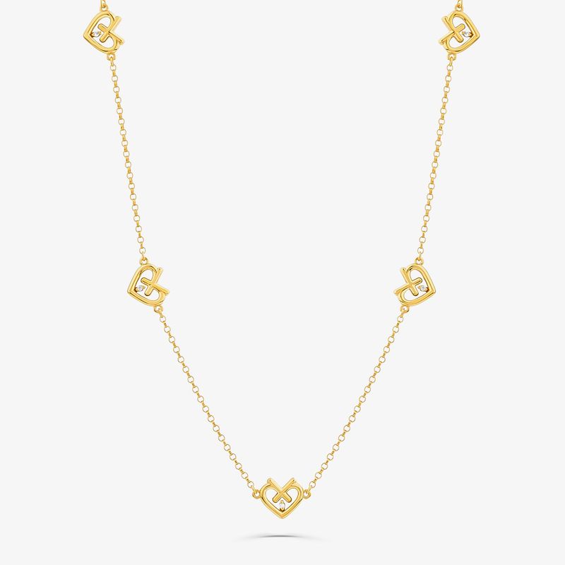 Colar dourado com elos em formato de coração e símbolos de dólares, intercalados por uma corrente fina.